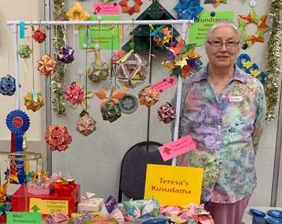 [Teresa With Her Origami Items For Sale as a Fundraiser]